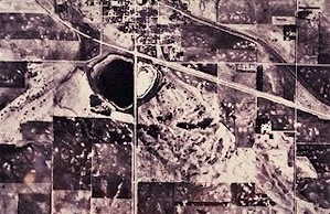 Figure 2. View from the air over the town of Anamoose in southeastern McHenry County. Steele Lake, on the south edge of town, is adjacent to an ice-thrust hill immediately to its southeast. The hill consists of material that was moved by the glacier, southeastward from where the lake is now.
