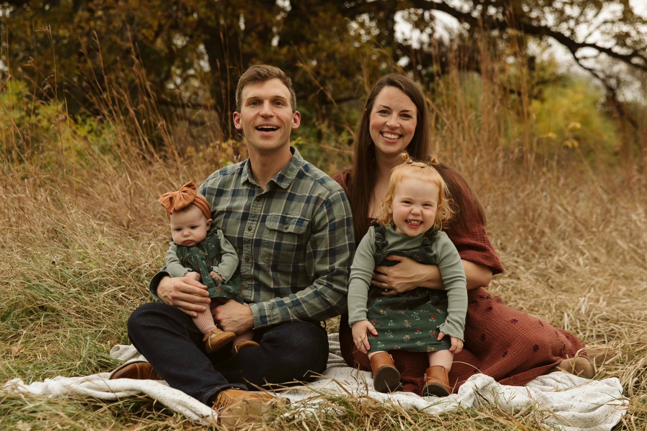 North Dakota State Superintendent Levi Bachmeier, his wife Rachel, and their two daughters, Roslin (left) and Linden (right).