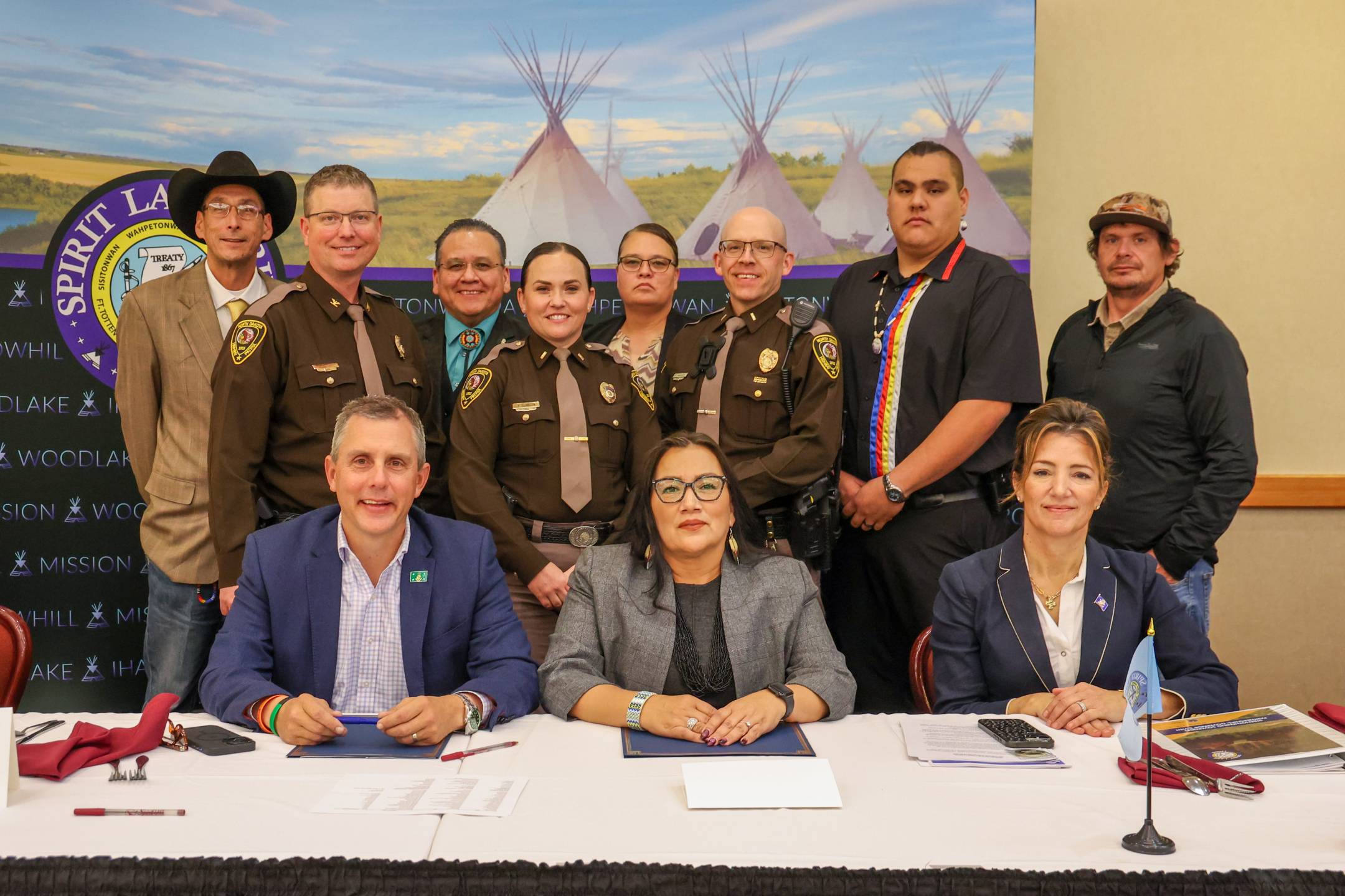 Governor Armstrong, Chairwoman Lonna Street Jackson and others at the signing of the updated agreement
