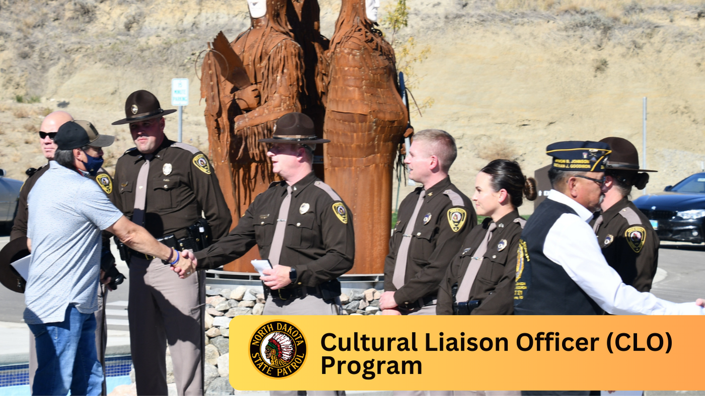 Officers meeting with tribal members at an outdoor venue