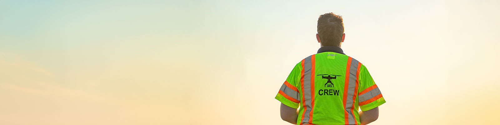 UAS operator wearing a safety vest. 
